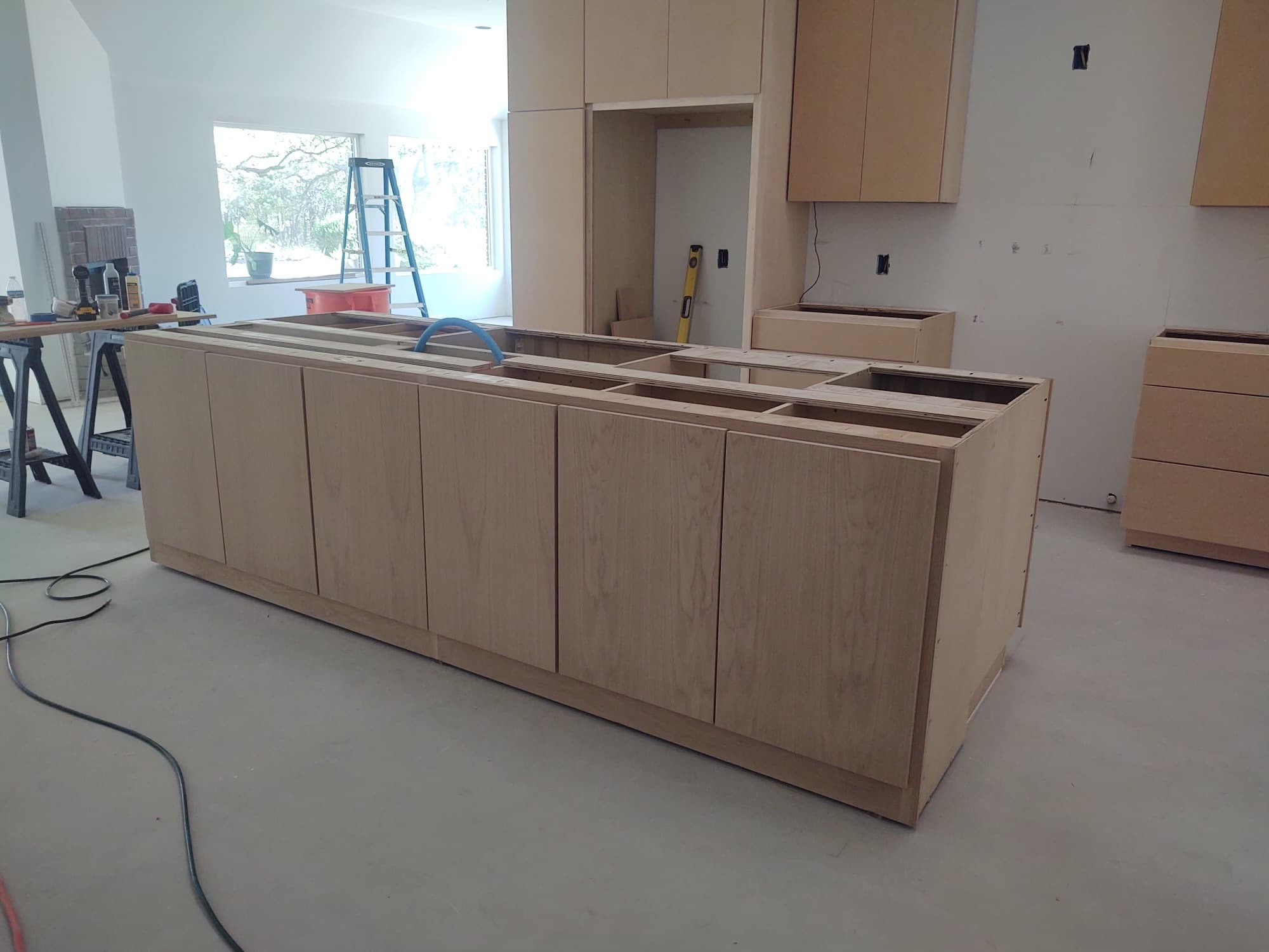 Professional Installation — Kitchen island and cabinetry during install